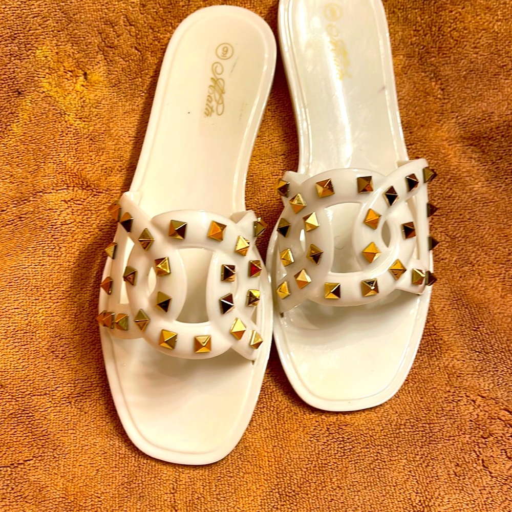 ACata size 9 beach to park sandals white with brush gold studs.  Slightly used